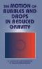 The Motion of Bubbles and Drops in Reduced Gravity